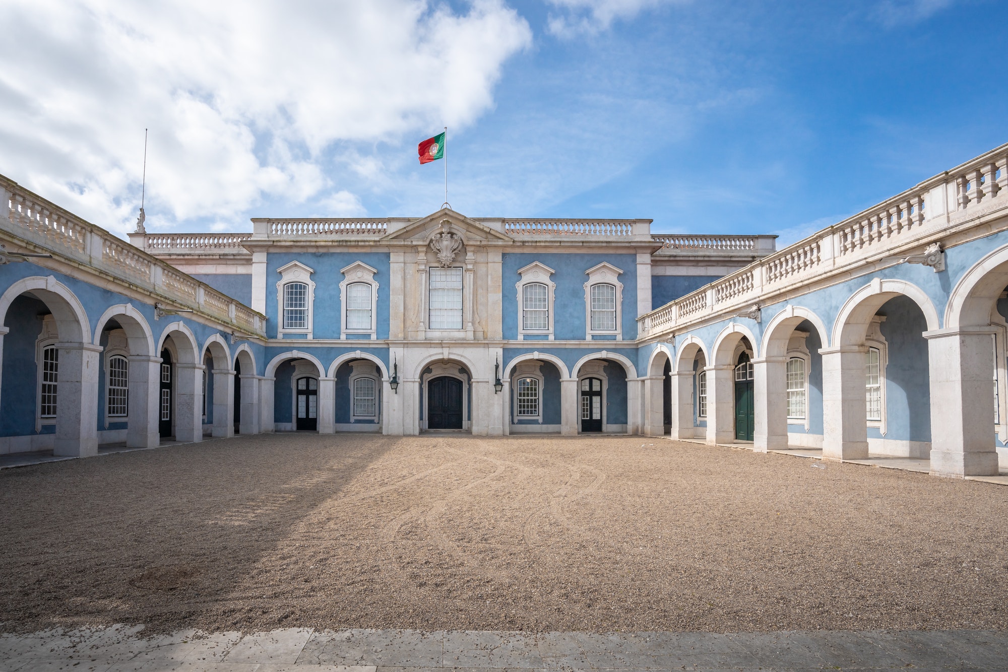 Palace of Queluz facade with portuguese flag - Queluz, Portugal